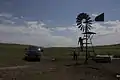 Checking a windmill on Spade Ranch summer range (c. 2009)