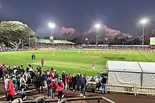 Two teams of women playing football