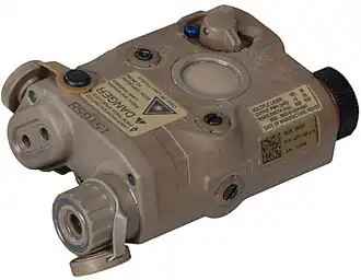 an isometric angle color photo of an AN/PEQ-15 looking from the top left