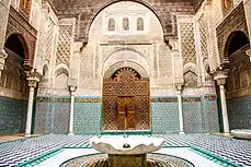 Interior facade of Al-Attarine Madrasa, showing ornate decoration