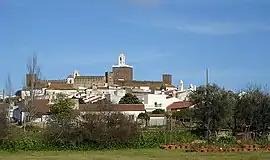 A profile of Alandroal showing the parochial church and low-lying buildings