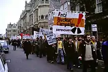 Large group of peaceful protesters with banners