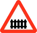 Railway level crossing with gate or barrier