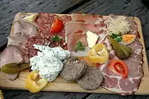 Typical Carinthian or Styrian "Brettljause", composed of different kinds of cold meat, horseradish, hard-boiled egg, meat paste, Liptauer, vegetables, butter and curd cheese