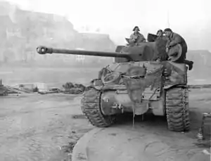 A British Sherman Firefly tank fitted with track grousers