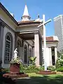 Statue of the Virgin Mary and Glorious Cross on the grounds of the cathedral.