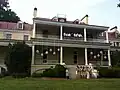 A wedding rehearsal on the rear terrace of the mansion