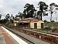 Southbound view of the old station from the current platform, June 2023