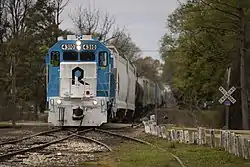 Picture of a Rock Island freight train, led by EMD GP38 #4310, in 2021