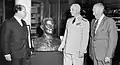 Sculptor Felix de Weldon (left) presents his bust of Fleet Admiral Chester W. Nimitz to the Naval War College on 5 June 1964. Austin (center) and retired U.S. Marine Corps Lieutenant General Keller E. Rockey (right) look on.