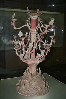 An Eastern Han ceramic candle-holder with animal figurines