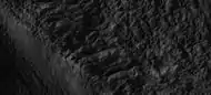 Close-up of the edge of one of the glaciers on the bottom of the wide view from a previous image Picture was taken by HiRISE under the HiWish program.