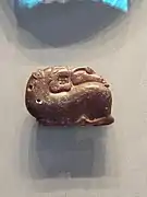 Etruscan amber pendant of a lion and a swan