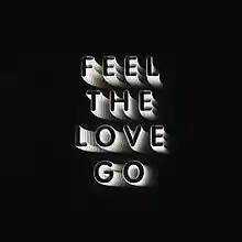 The sentence, "Feel The Love Go", in black text, outlined in white on a black background.