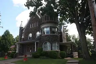 Gothic Revival Gatehouse and office (1900-1901).