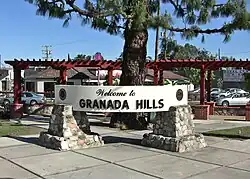 A welcome sign at Chatsworth Street and Zelzah Avenue