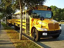 An International DuraStar used to transport Dumpsters