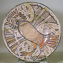 A Manises plate, c. 1535.  A fantastical owl wearing a crown, a characteristic Manises design during the first half of the 16th century