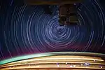 Star trails photographed in earth orbit from the International Space Station