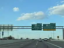 Photograph of a sign on I-40 directing drivers to the eastern terminus of SR 158