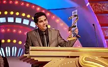 Kamāl Khan at Zee Cine Awards 2012, receiving "Fresh Singing Talent" 2012 Award.