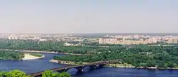 View of the left-bank Kyiv and the Dnieper River. Background high-rise buildings in the right are in the Dniprovskyi Raion.