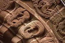 Other details of the arch include serpents and dragons swallowing their tails (see Ouroboros)