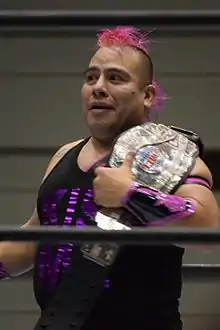 A color photo of Máximo Sexy standing in a wrestling ring