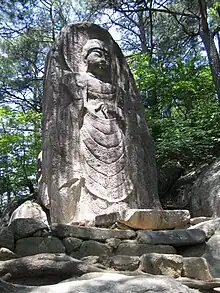 The carved image of the standing Buddha (마애불입상) on Gayasan, Hapcheon, South Korea.