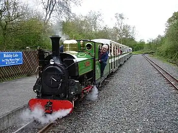 Image 8Ruislip Lido Railway's 12-inch (300 mm) gauge locomotive "Mad Bess" hauling a passenger train.