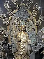 Altarpiece dedicated to Buddha Maitreya, Northern Wei dynasty (386–534), dated 524. Gilt bronze. Metropolitan Museum of Art.