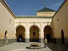 Main courtyard next to the mausoleum (cupola of the tomb chamber visible in the upper right)