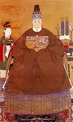 Noble lady wearing a round-collared jacket as upper garment and a skirt as lower garment (front) Lady-in-waiting wearing a short-sleeved round collar jacket with a skirt (left), Ming dynasty.