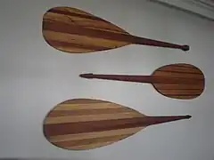 Hawaiian canoe paddles on wall