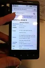 A Motorola Droid X showing an Android 2.3 home screen