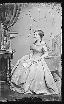 Portrait of Myra Clark Gaines seated, looking away from camera.