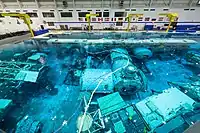 The 6.2 million US gallons (23 million litres) tank includes mock-ups of International Space Station modules and other training materials