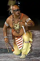 Member of the Warriors of AniKituhwa, a traditional Eastern Cherokee band dance troupe