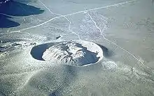 Ring of gray rock with a dome of gray rock inside it.