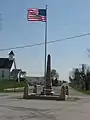 World War I veterans memorial in Pickrelltown (2010 photo).  The 8 ft (2.4 m) high granite monument was erected in 1921, and has twice been rebuilt after vehicles crashed into it.