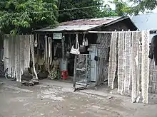 Leather goods and skins of Burmese python (Python molurus bivittatus) and reticulated python (Python reticulatus reticulatus) at a local shop at Mandalay, Burma