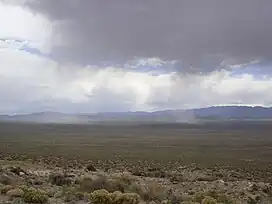 A photo of a storm over the Wah Wah Mountains and Wah Wah Valley