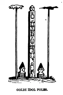 Black and white drawing of a straight rectangular pole with animal-shaped decorations on it. The pole is flanked on each side with a thinner pole topped with what appears to be an animal. The caption, written in capital letters, reads "Goldi Idol Poles".