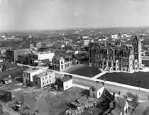 Newly built gingerbread City Hall in 1909 while immediately surrounding business district largely still to come.