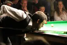 Ronnie O'Sullivan playing a shot