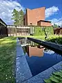 The courtyard with a fountain and a sculpture