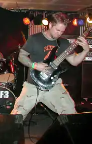 Hull playing guitar with Pig Destroyer