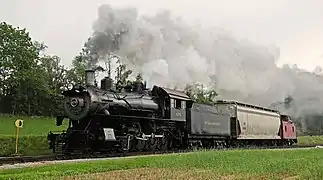 Strasburg No. 475 pulling a single hopper car at Cherry Hill Rd. in 2013