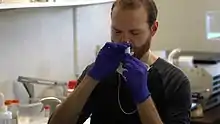 Alexander Hoekstra self-administering an experimental, intranasal COVID-19 vaccine developed by Rapid Deployment Vaccine Collaborative in 2020.