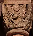 Romanesque capital in Sigolsheim showing Jews with characteristic hats on each lower corner